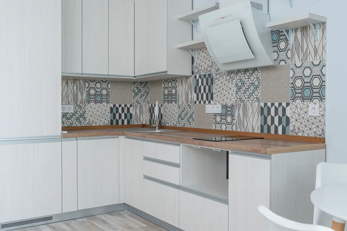 How to Tile a Kitchen Splashback Around Sockets Safely